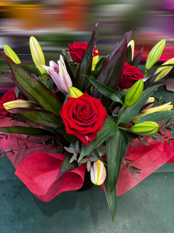 Vase of lilies and roses