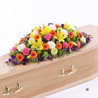 Vibrant Casket Spray with Yellow Lilies