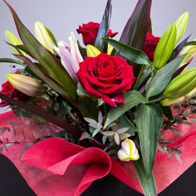 Vase of lilies and roses