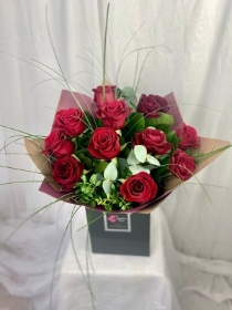 12 Stunning red roses with gypsophilia